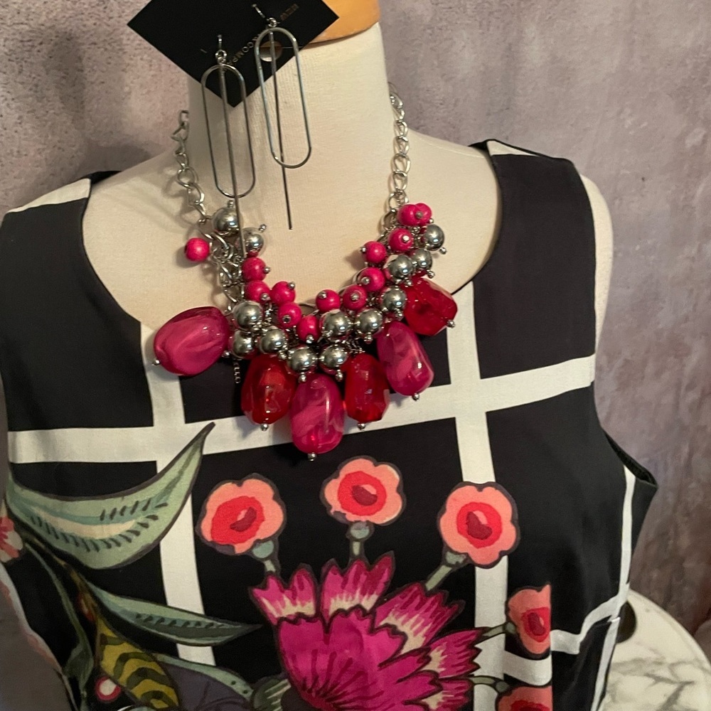 Beautiful floral‎ design agains black and white geometric pattern.
